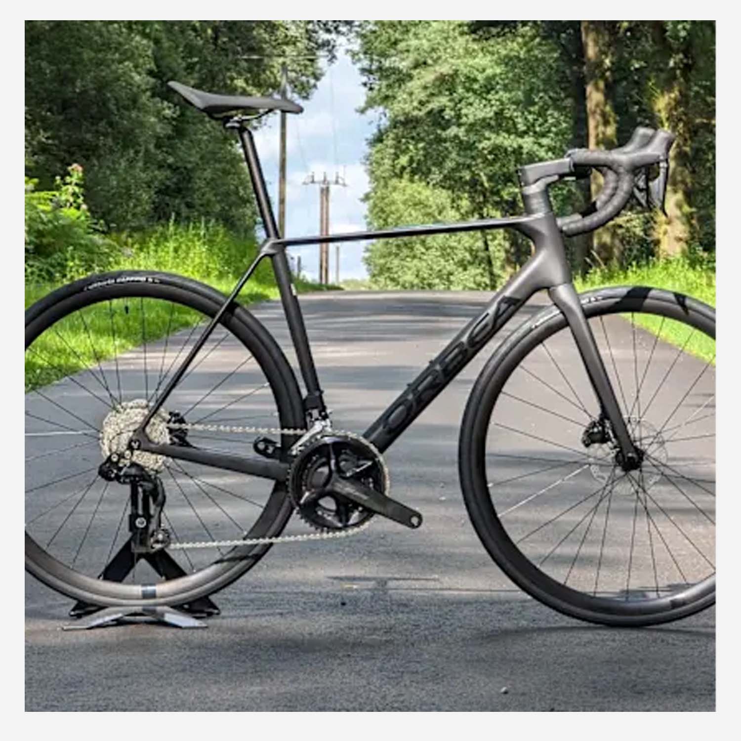 Orbea Orca M30i Road Bike, Shimano 105 Di2, Black, 2025, bixbybicycles.com